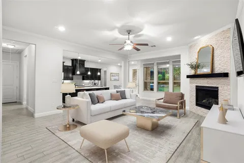 a living room with furniture and a fireplace