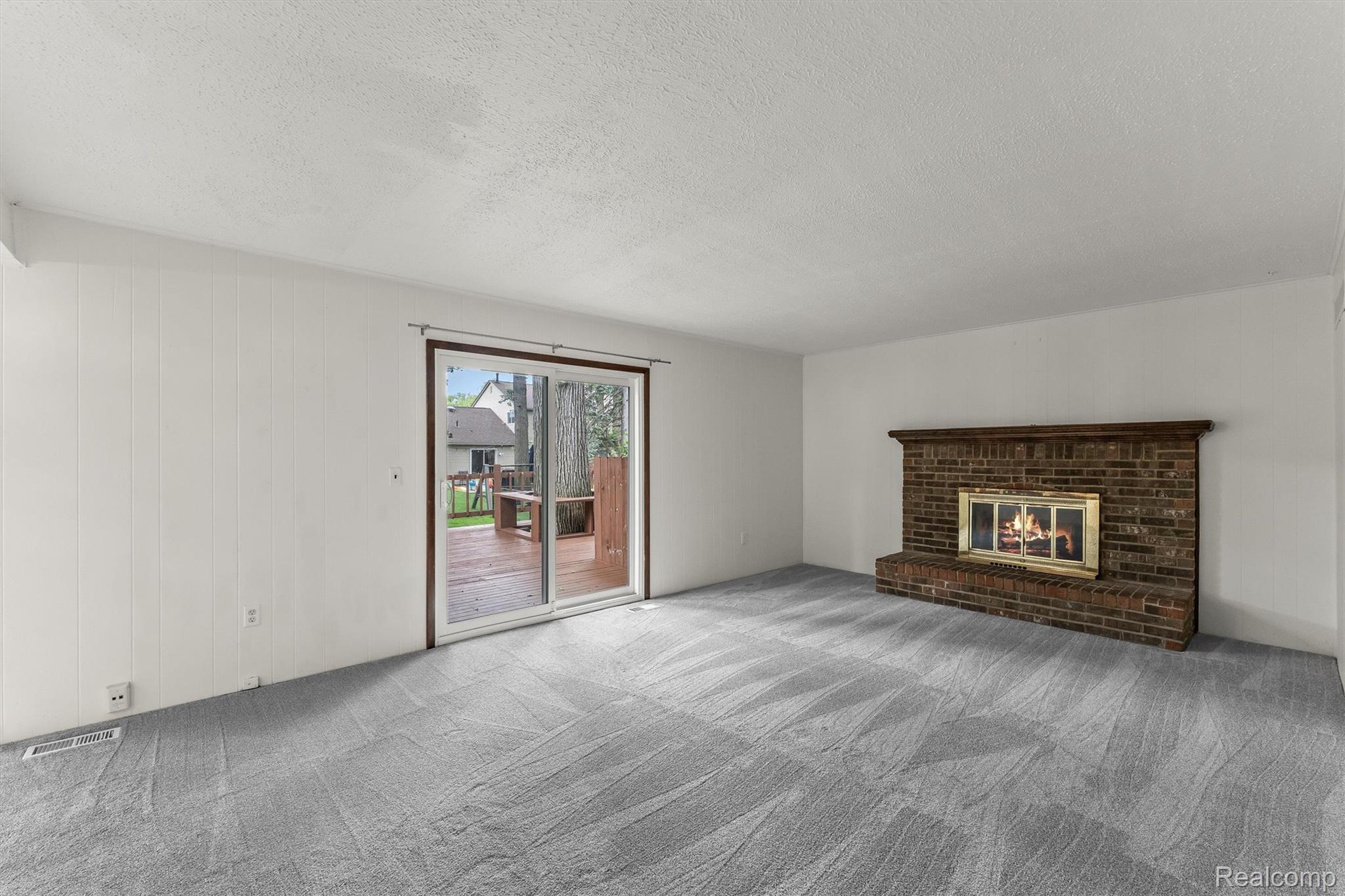 2118 Rutgers Drive Troy, MI 48085 - Photo 13 of 39 Brick fireplace with a wood mantel