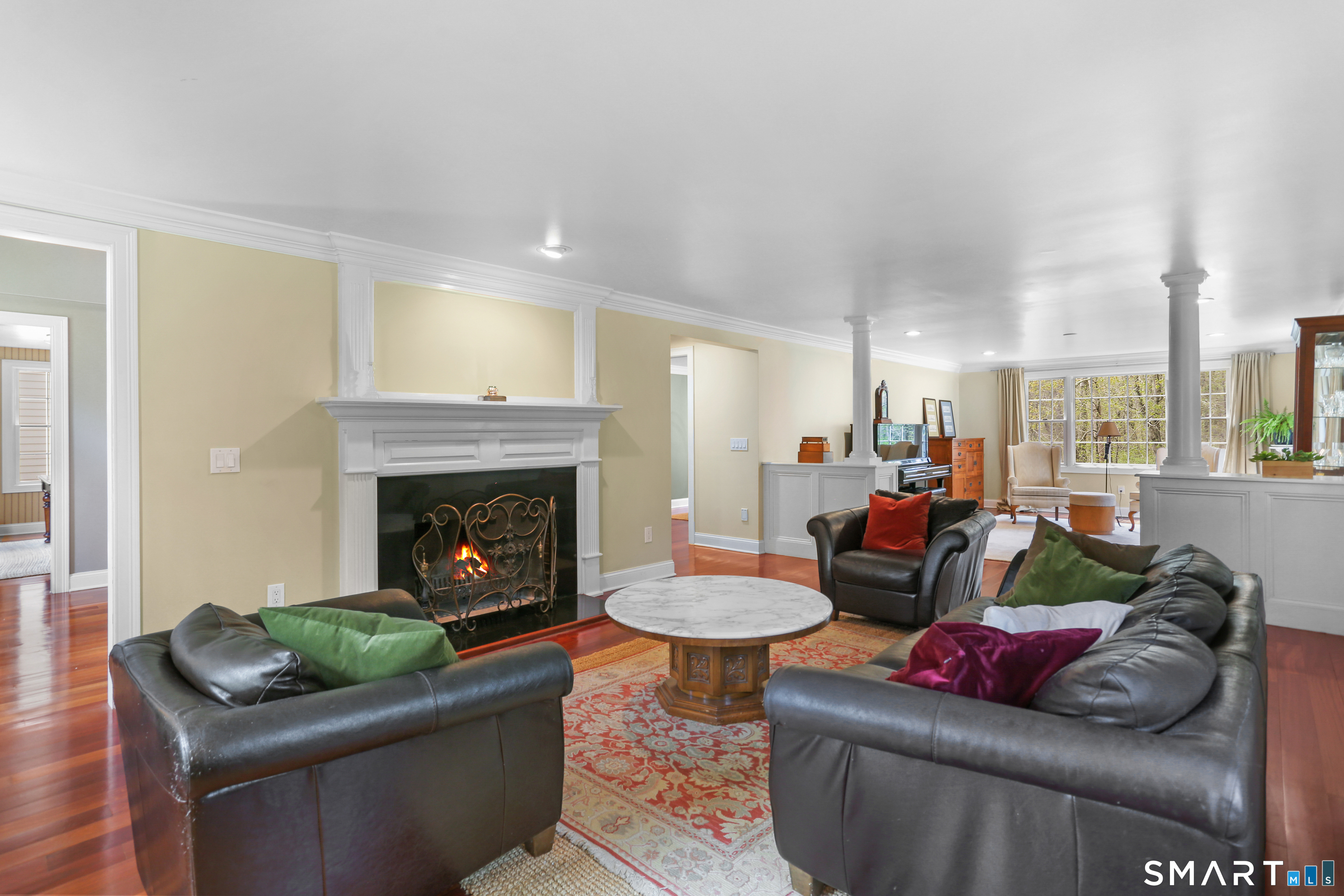 4041 Redding Road Fairfield, CT 06824 - Photo 11 of 38 Wood burning fireplace provides a cozy space on cold nights.