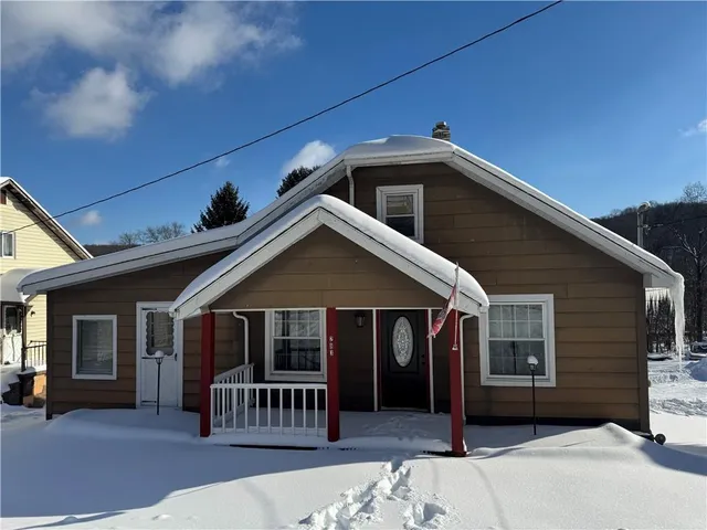 a front view of a house with a porch
