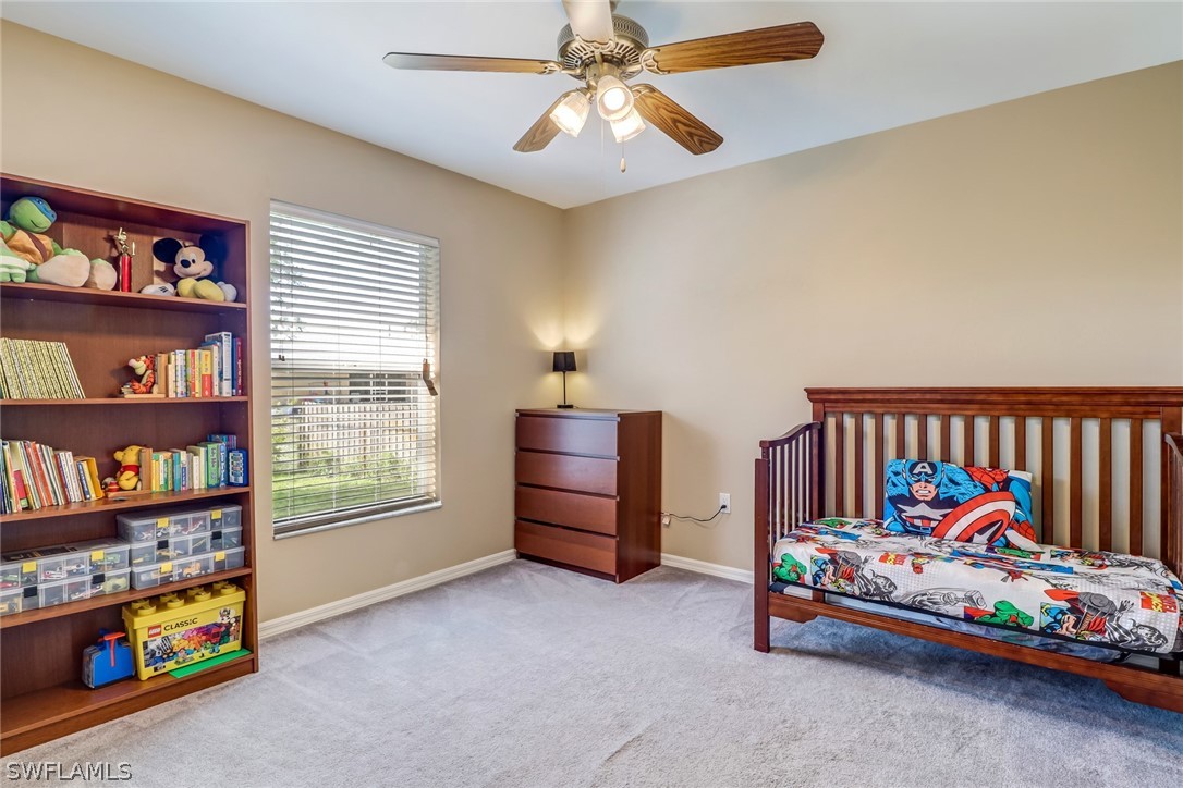 9050 Henry Road Fort Myers, FL 33967 - Photo 12 of 16 a children room with toys and a baby crib