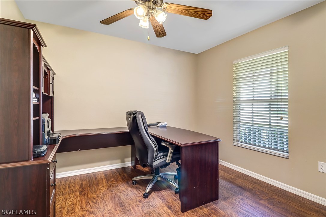9050 Henry Road Fort Myers, FL 33967 - Photo 14 of 16 a view of a workspace with furniture and a window