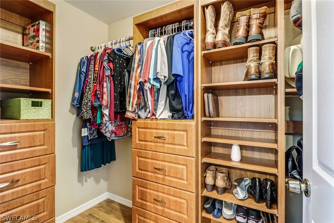 9050 Henry Road Fort Myers, FL 33967 - Photo 10 of 16 a view of walk in closet with clothes and shoes