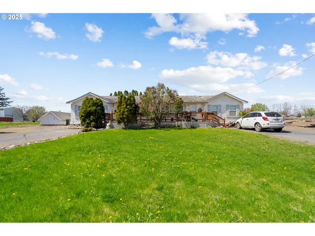 a living room with furniture gym equipment and a flat screen tv