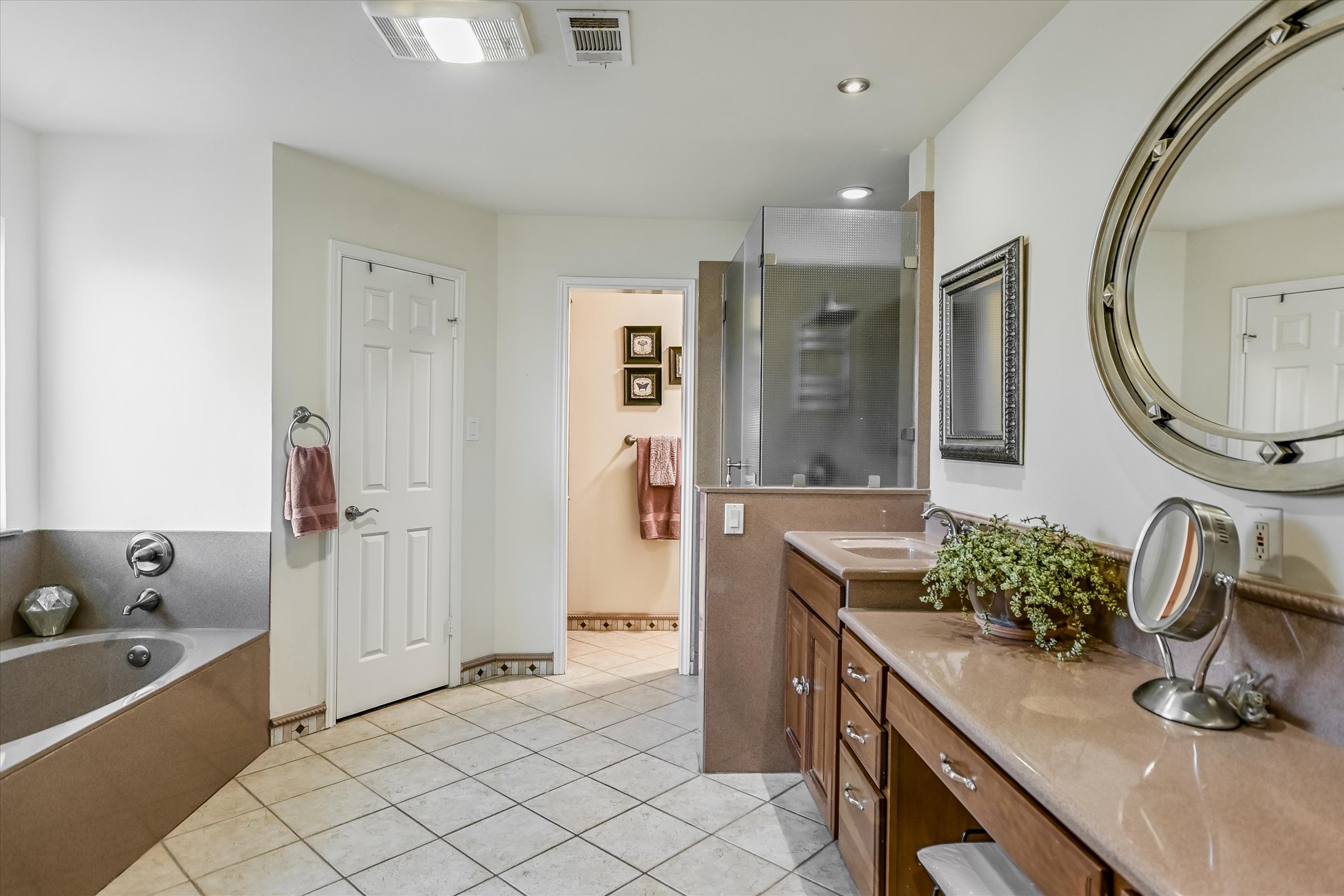 1801 Sun Lake Round Rock, TX 78681 - Photo 15 of 31 Primary bathroom features a garden tub, a generous double vanity, separate water closet, and a separate shower.