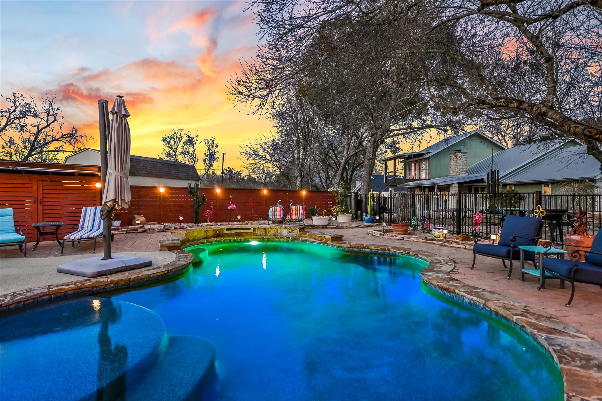 1801 Sun Lake Round Rock, TX 78681 - Photo 26 of 31 The in-ground pool with a large swim shelf is the perfect place to escape from the summer heat. Many neighborhood gatherings happen in this pool and the gathering space just behind the fence!