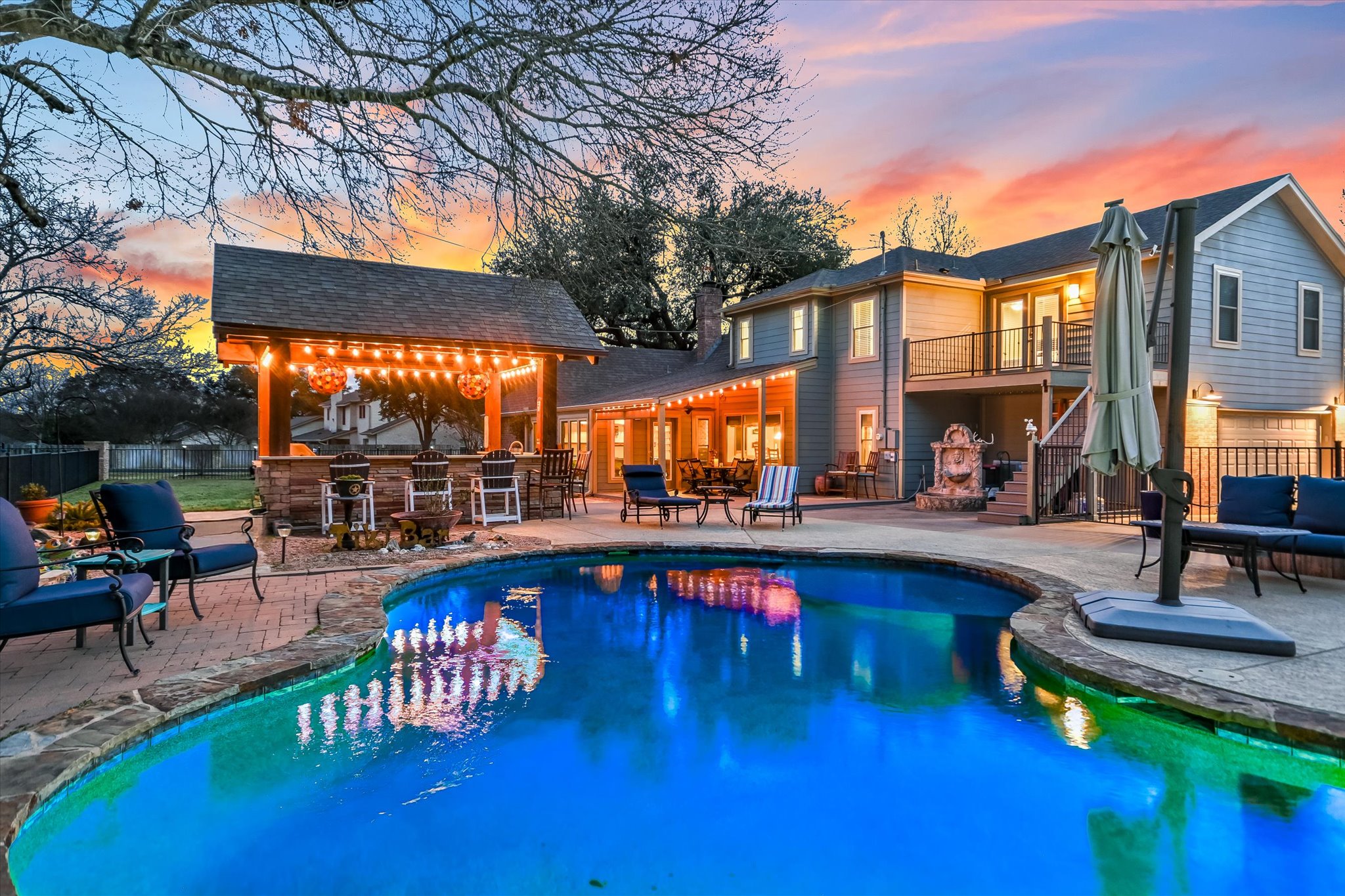 1801 Sun Lake Round Rock, TX 78681 - Photo 4 of 31 The ultimate back yard for entertaining! Cabana, covered patio, and beautiful in-ground pool!
