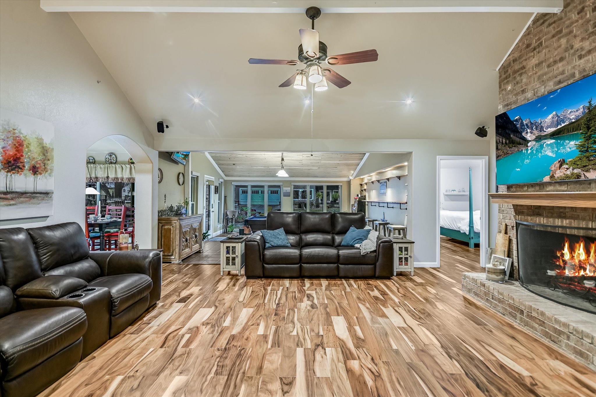 1801 Sun Lake Round Rock, TX 78681 - Photo 8 of 31 Looking into the central living area from the foyer. The primary bedroom is through the door you see just beyond the fireplace, and the gameroom is behind the couch you see in the center of the photo.
