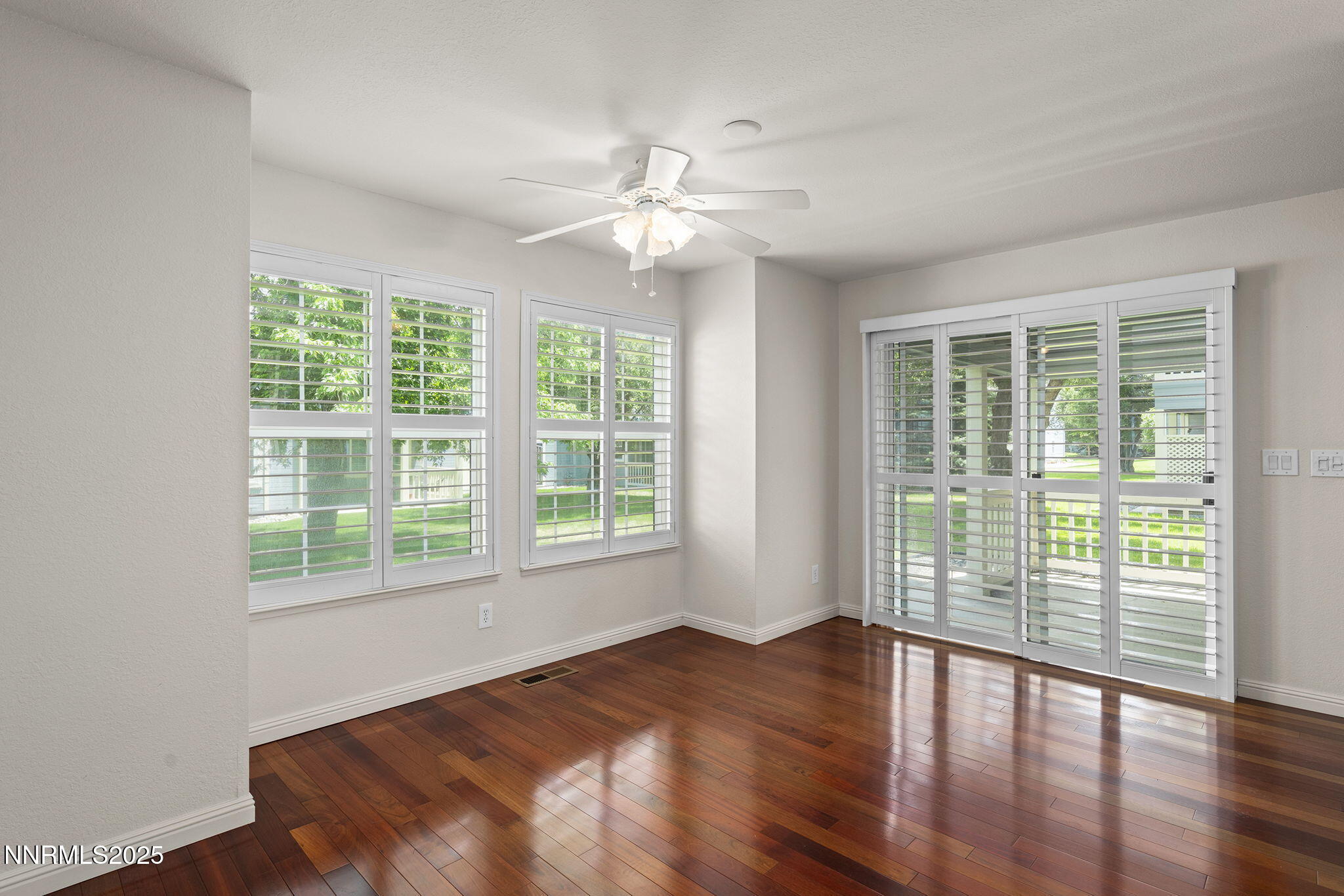 3003 Chubasco Way Carson City, NV 89701 - Photo 11 of 27 a view of an empty room with wooden floor and a window