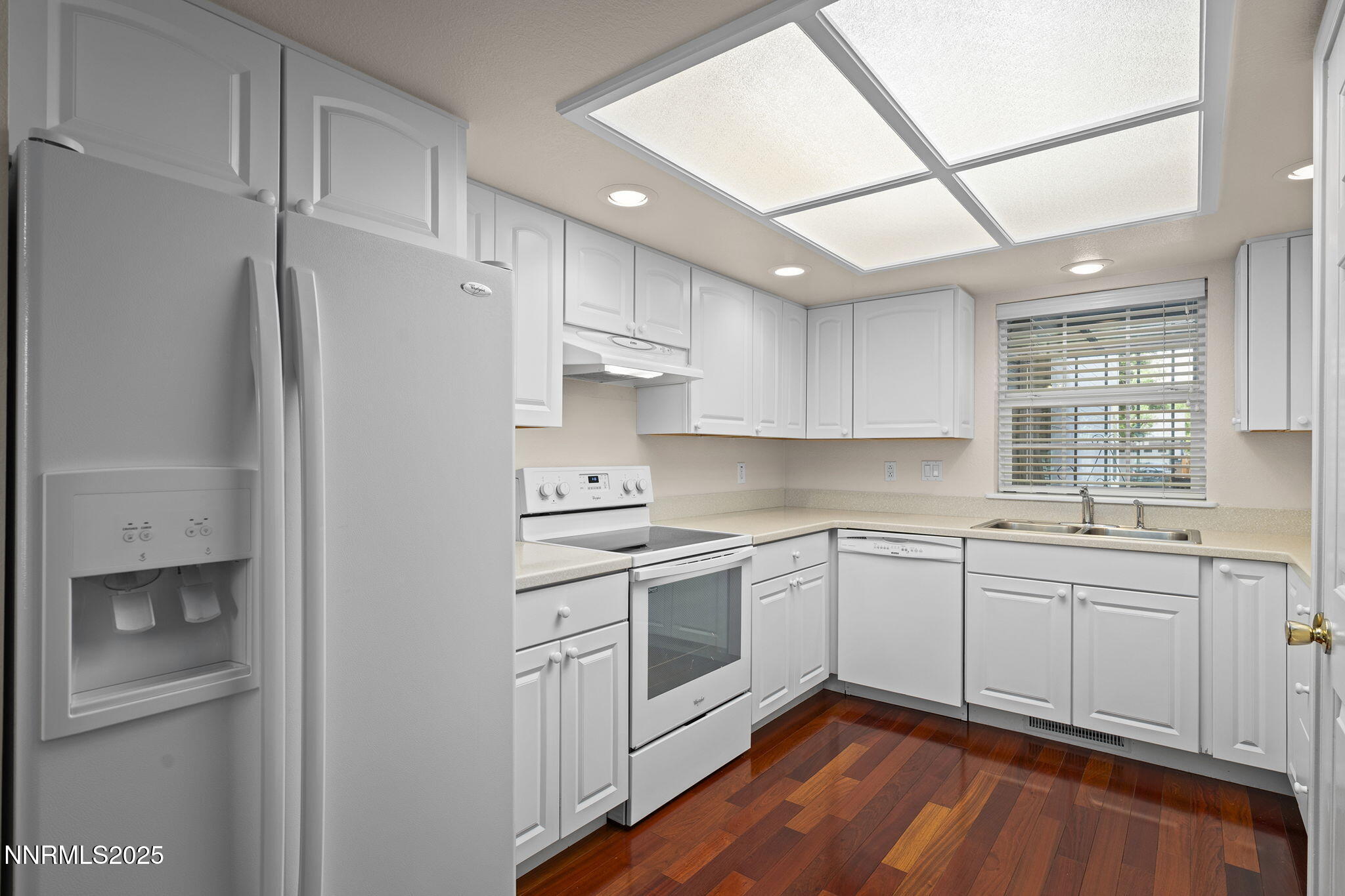 3003 Chubasco Way Carson City, NV 89701 - Photo 12 of 27 a kitchen with white cabinets and white appliances