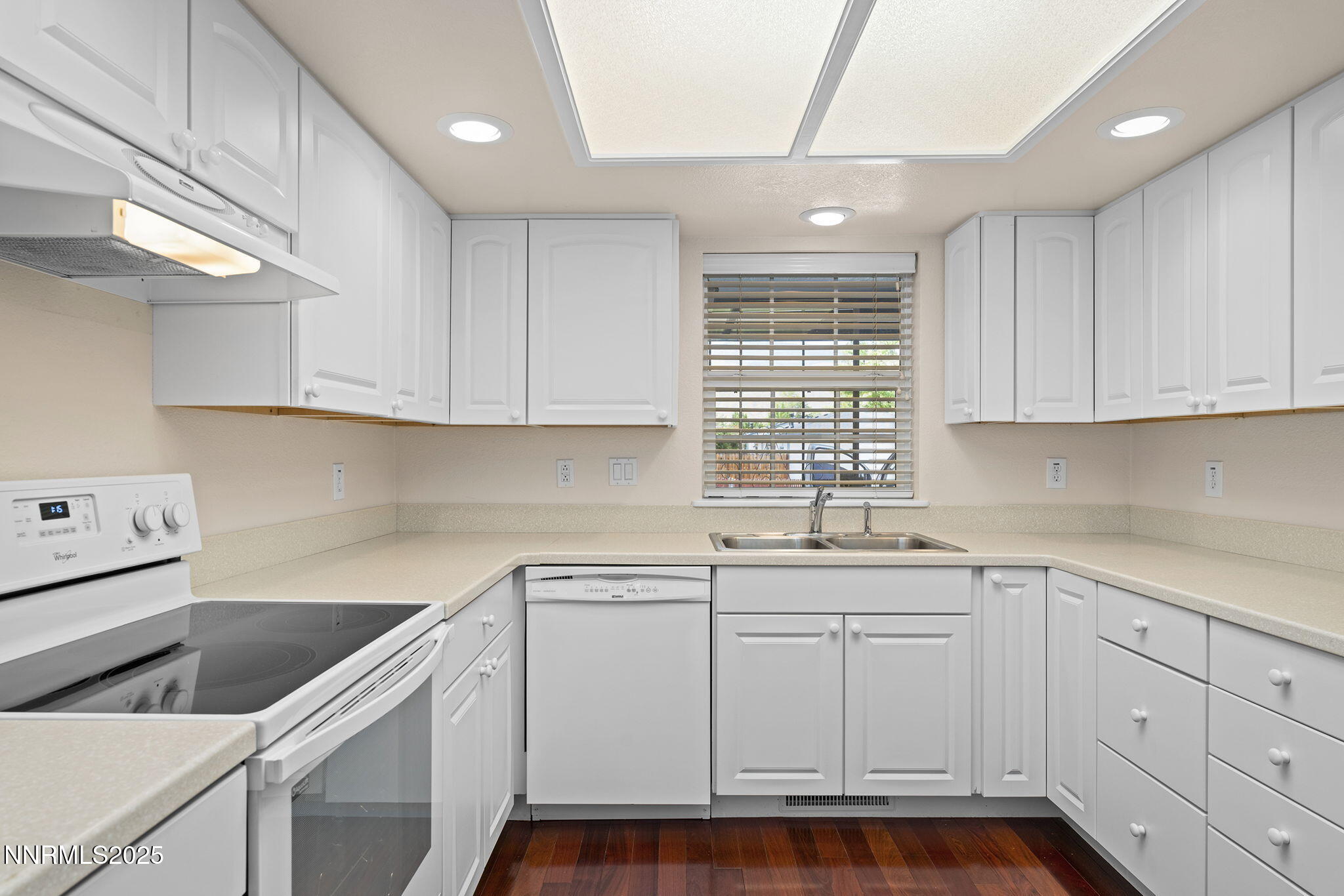 3003 Chubasco Way Carson City, NV 89701 - Photo 13 of 27 a kitchen that has a lot of cabinets in it and wooden floors