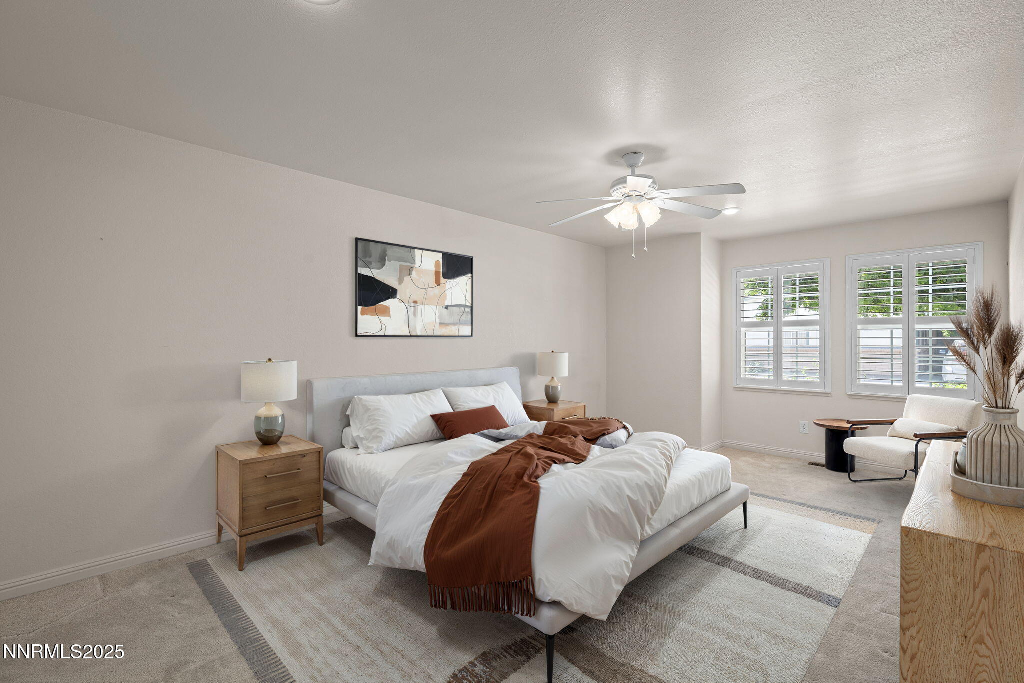 3003 Chubasco Way Carson City, NV 89701 - Photo 15 of 27 a bedroom with a bed couch and a large window