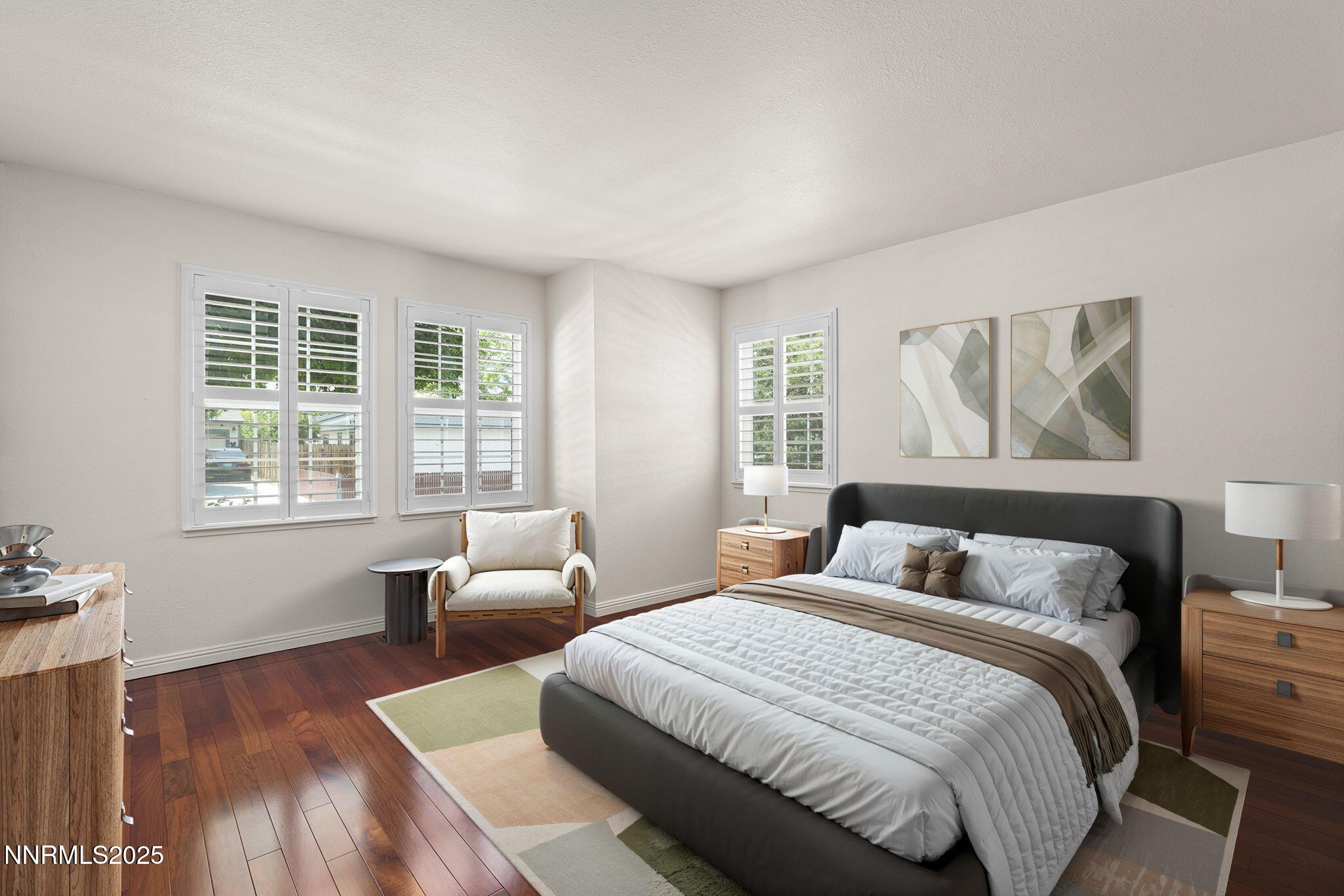 3003 Chubasco Way Carson City, NV 89701 - Photo 20 of 27 a bedroom with a bed and wooden floor