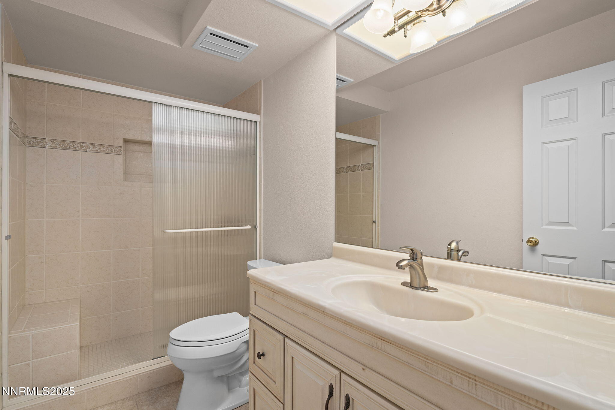 3003 Chubasco Way Carson City, NV 89701 - Photo 22 of 27 a bathroom with a sink toilet and shower
