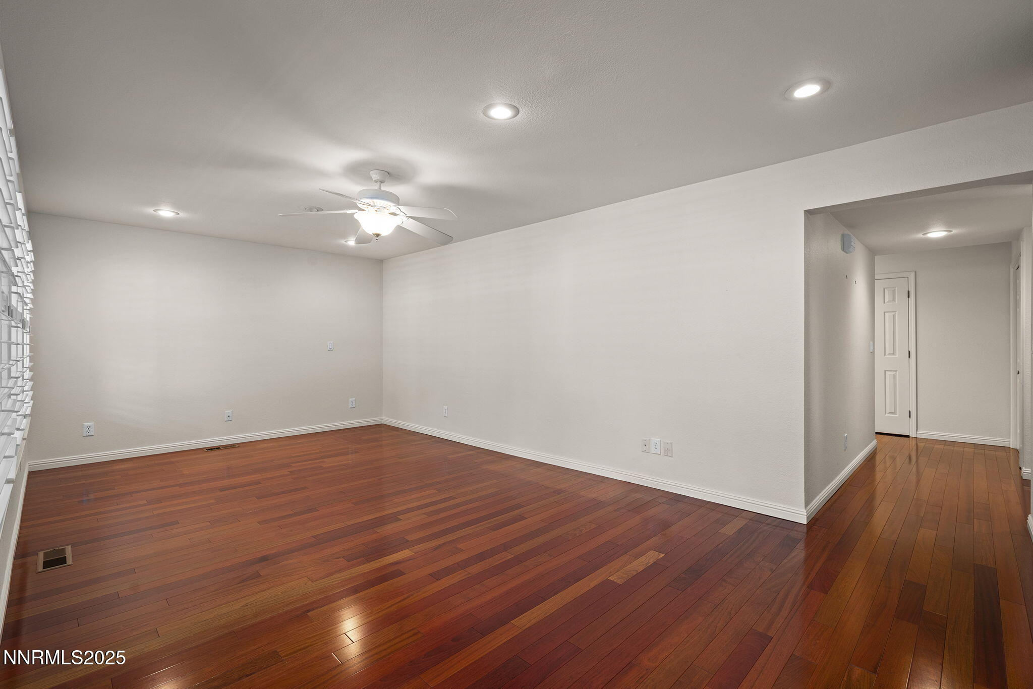 3003 Chubasco Way Carson City, NV 89701 - Photo 7 of 27 a view of an empty room with wooden floor