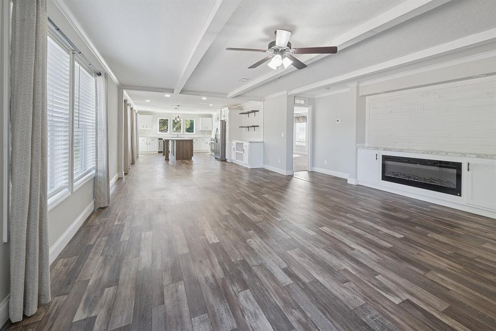 19750 Southeast 30th Street Morriston, FL 32668 - Photo 20 of 52 wooden floor in an empty room with a window
