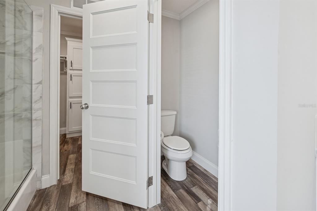 19750 Southeast 30th Street Morriston, FL 32668 - Photo 43 of 52 a bathroom with a toilet and a vanity