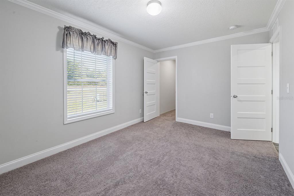 19750 Southeast 30th Street Morriston, FL 32668 - Photo 49 of 52 an empty room with windows and closet