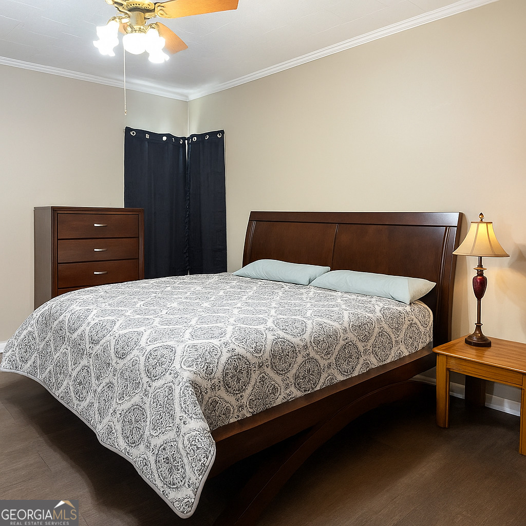 405 South Leroy Street Metter, GA 30439 - Photo 11 of 18 a bed sitting in a bedroom and dresser