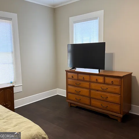 a living room with furniture and flat screen tv
