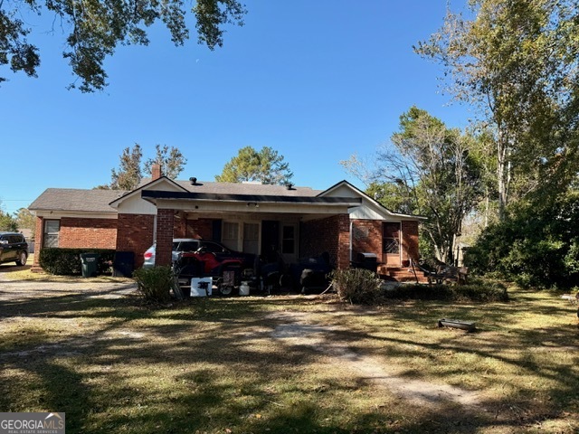 405 South Leroy Street Metter, GA 30439 - Photo 15 of 18 a view of a house with a patio