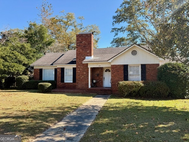 405 South Leroy Street Metter, GA 30439 - Photo 18 of 18 a front view of a house with yard and garage