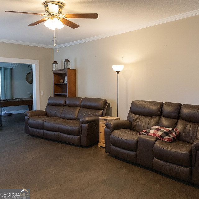 405 South Leroy Street Metter, GA 30439 - Photo 2 of 18 a living room with furniture and a chandelier