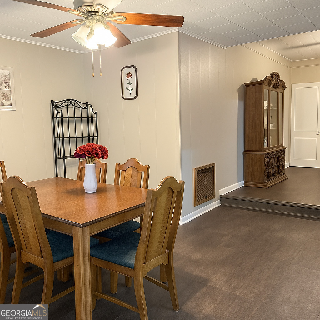405 South Leroy Street Metter, GA 30439 - Photo 7 of 18 a view of a dining room with furniture and chandelier
