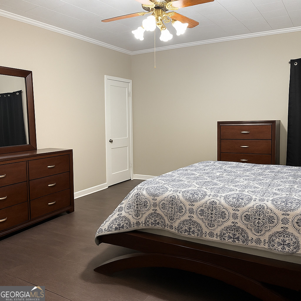 405 South Leroy Street Metter, GA 30439 - Photo 10 of 18 a bedroom with a bed and dresser