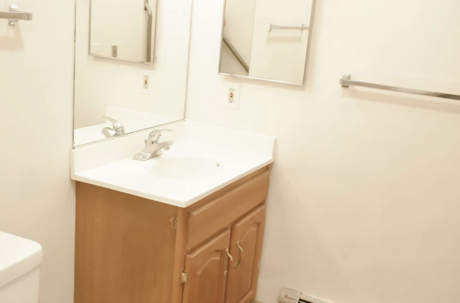 839 South Clinton Street Stockbridge, MI 49285 - Photo 18 of 29 a bathroom with a sink and a mirror