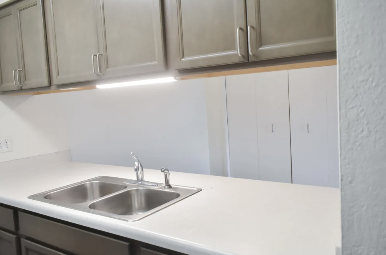 839 South Clinton Street Stockbridge, MI 49285 - Photo 23 of 29 a kitchen with a sink and cabinets