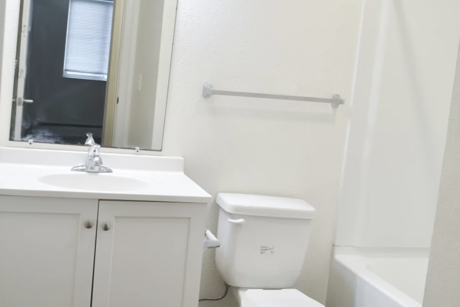 839 South Clinton Street Stockbridge, MI 49285 - Photo 29 of 29 a bathroom with a sink a toilet and a bathtub