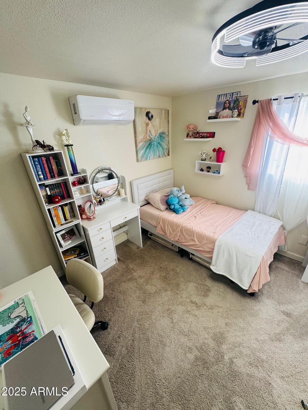 735 East 3rd Street Douglas, AZ 85607 - Photo 13 of 18 a bedroom with furniture and a book shelf