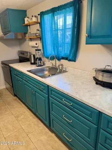 a room with cabinets and utility