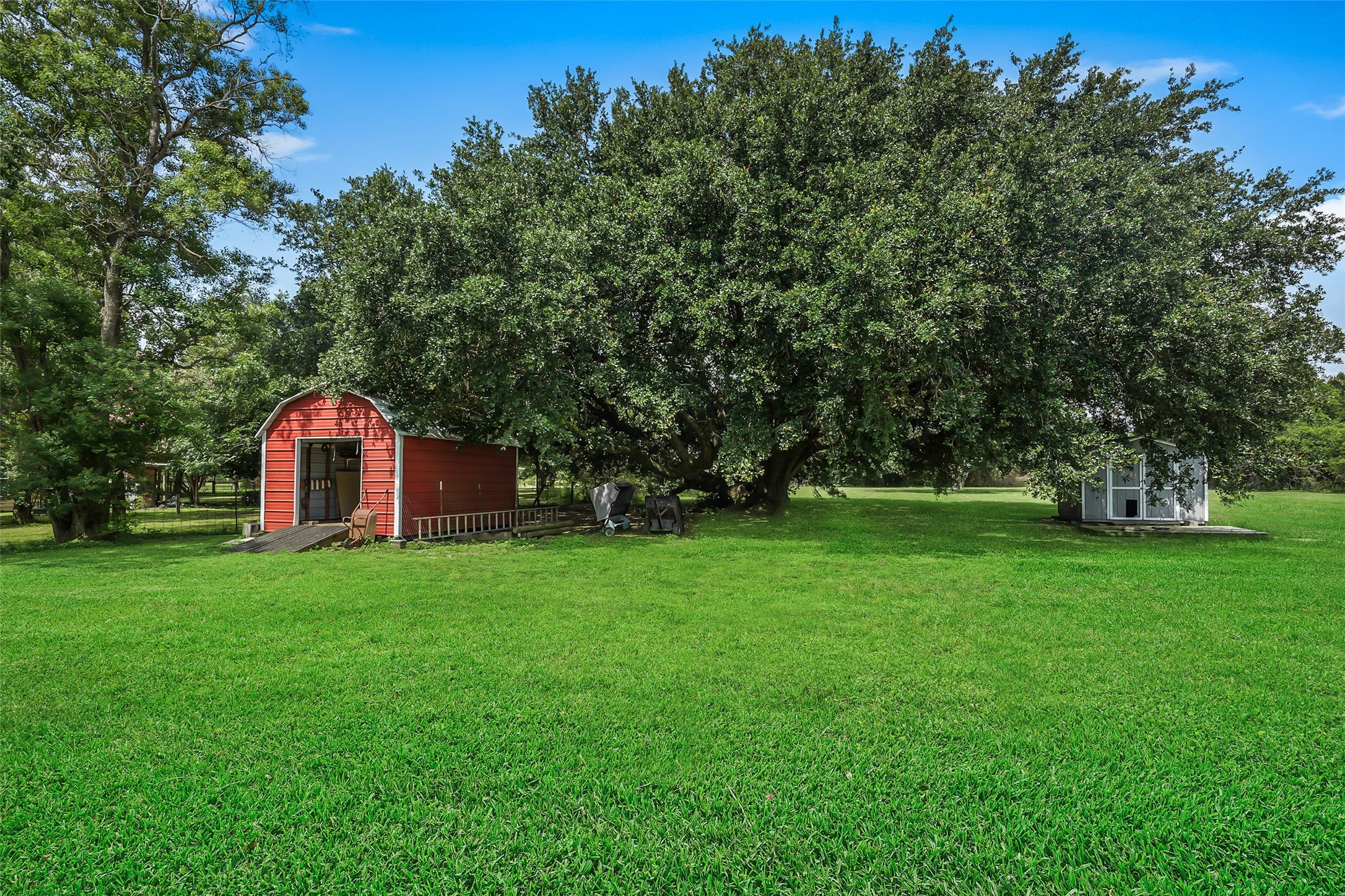 19635 Kermier Road Waller, TX 77484 - Photo 23 of 27 Additional storage building offers flexible space for equipment, tools, or hobby use