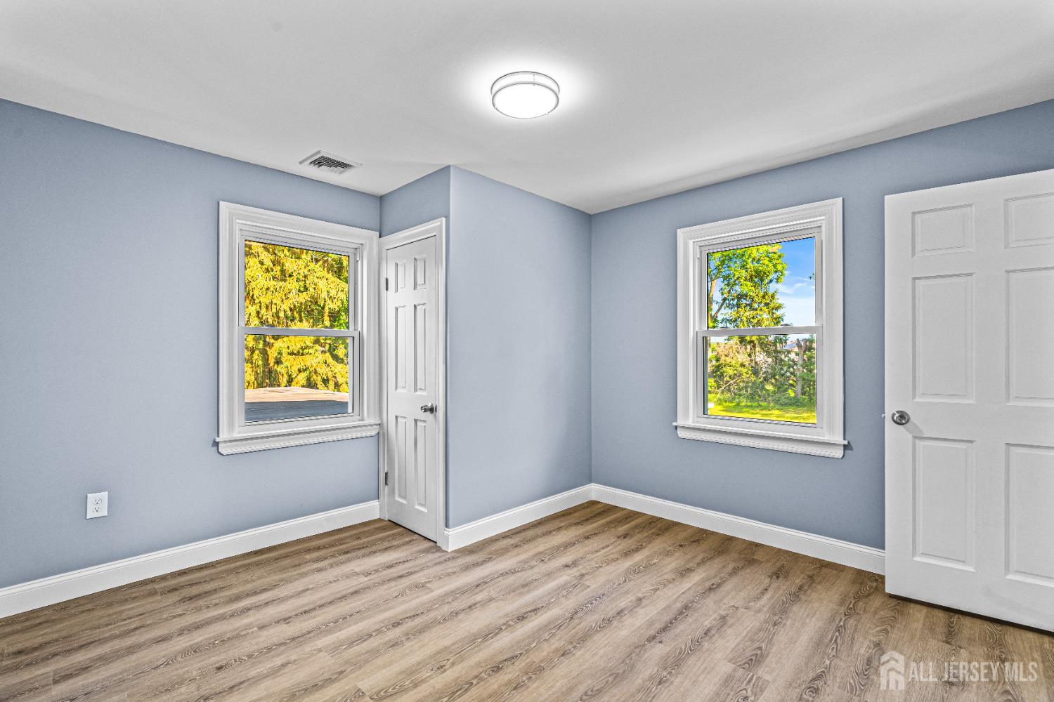 790 Ridge Road Monmouth Junction, NJ 08852 - Photo 14 of 38 an empty room with window and wooden floor