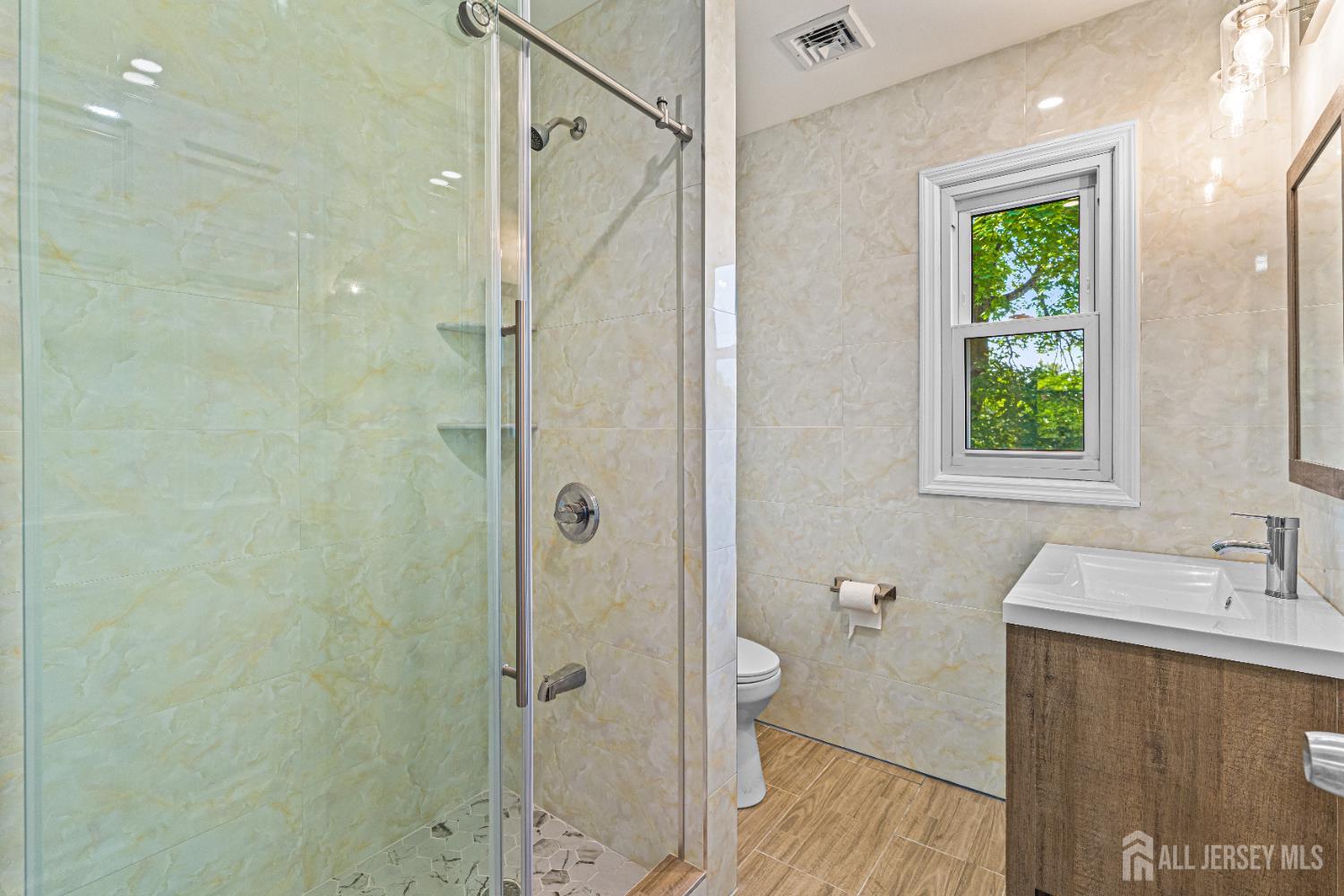 790 Ridge Road Monmouth Junction, NJ 08852 - Photo 19 of 38 a bathroom with a sink a toilet and shower