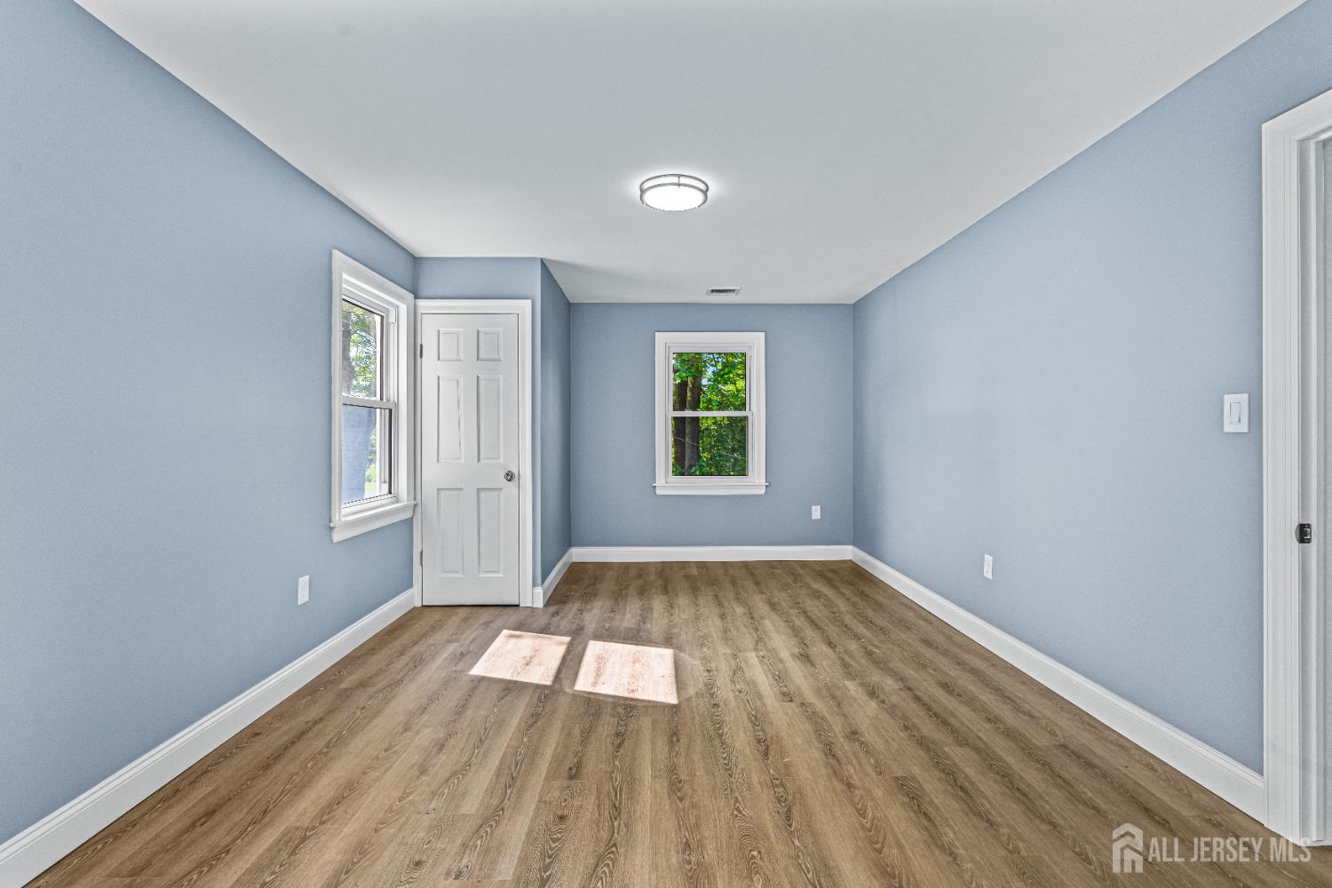 790 Ridge Road Monmouth Junction, NJ 08852 - Photo 20 of 38 wooden floor in an empty room with a window