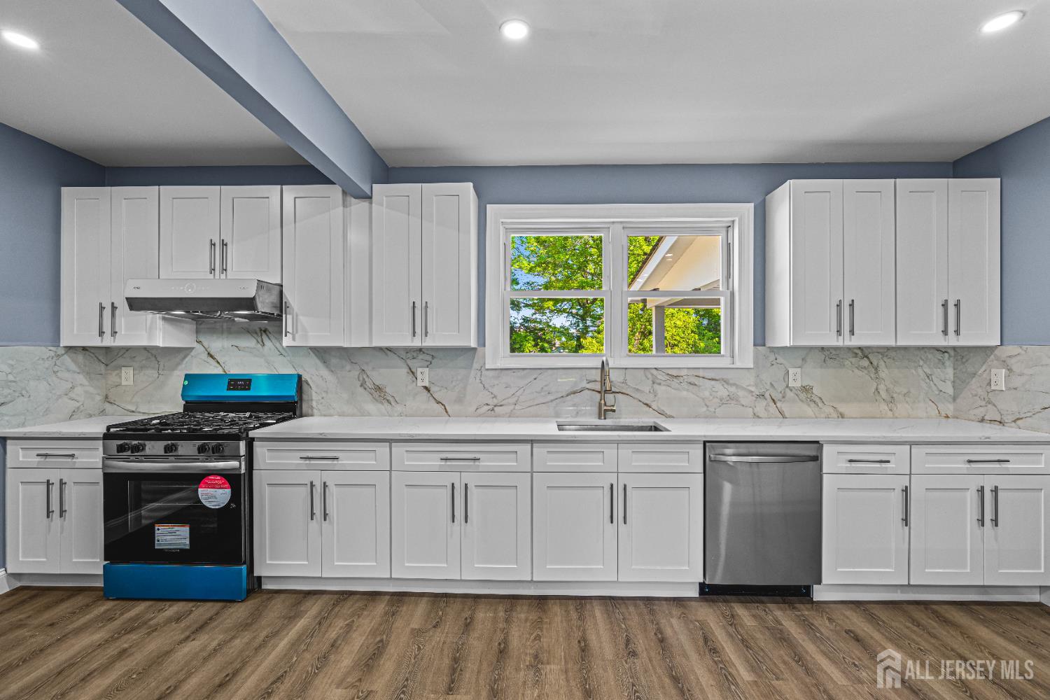 790 Ridge Road Monmouth Junction, NJ 08852 - Photo 30 of 38 a kitchen with a sink stove and cabinets