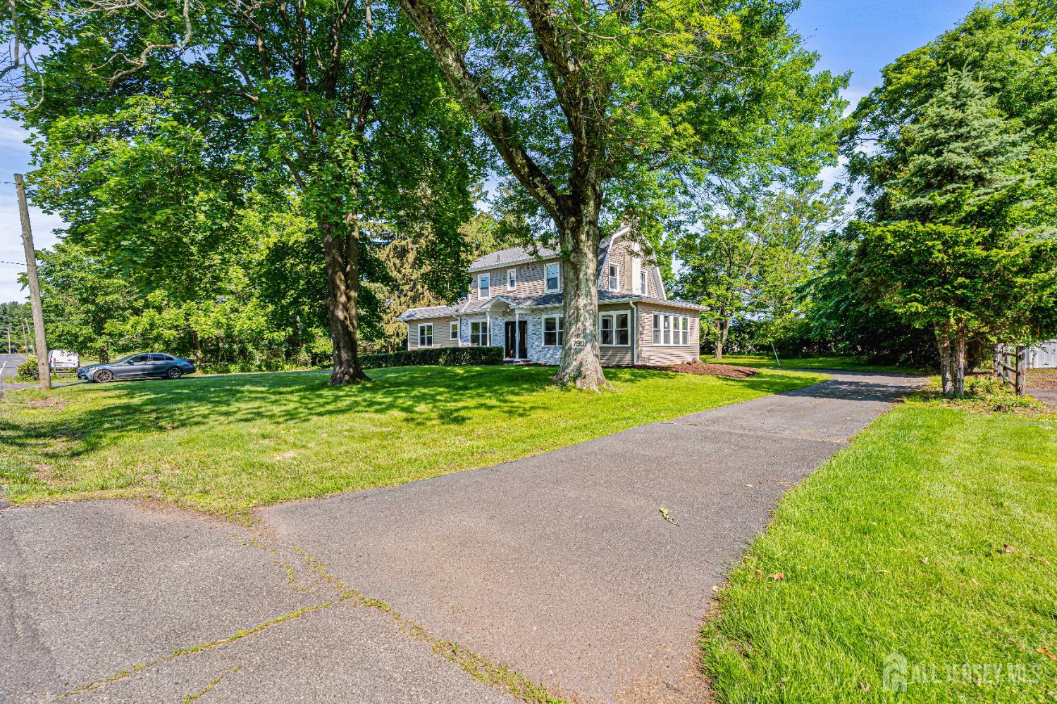 790 Ridge Road Monmouth Junction, NJ 08852 - Photo 3 of 38 a house with swimming pool in front of it
