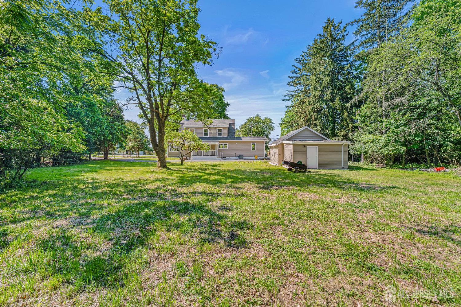 790 Ridge Road Monmouth Junction, NJ 08852 - Photo 7 of 38 a front view of a house with garden