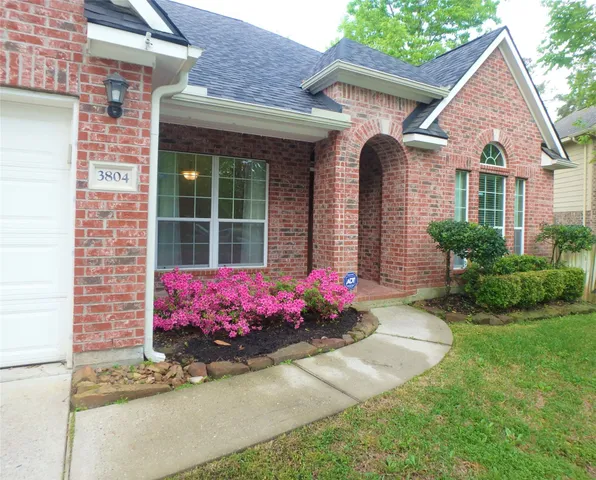 a front view of a house with yard