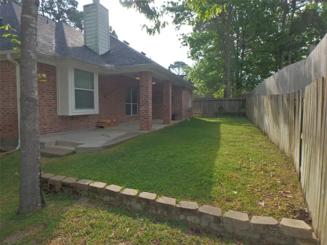 a backyard of a house with lots of green space