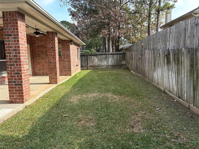 a view of backyard with large windows