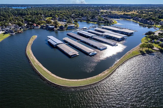 an aerial view of a house with a swimming pool