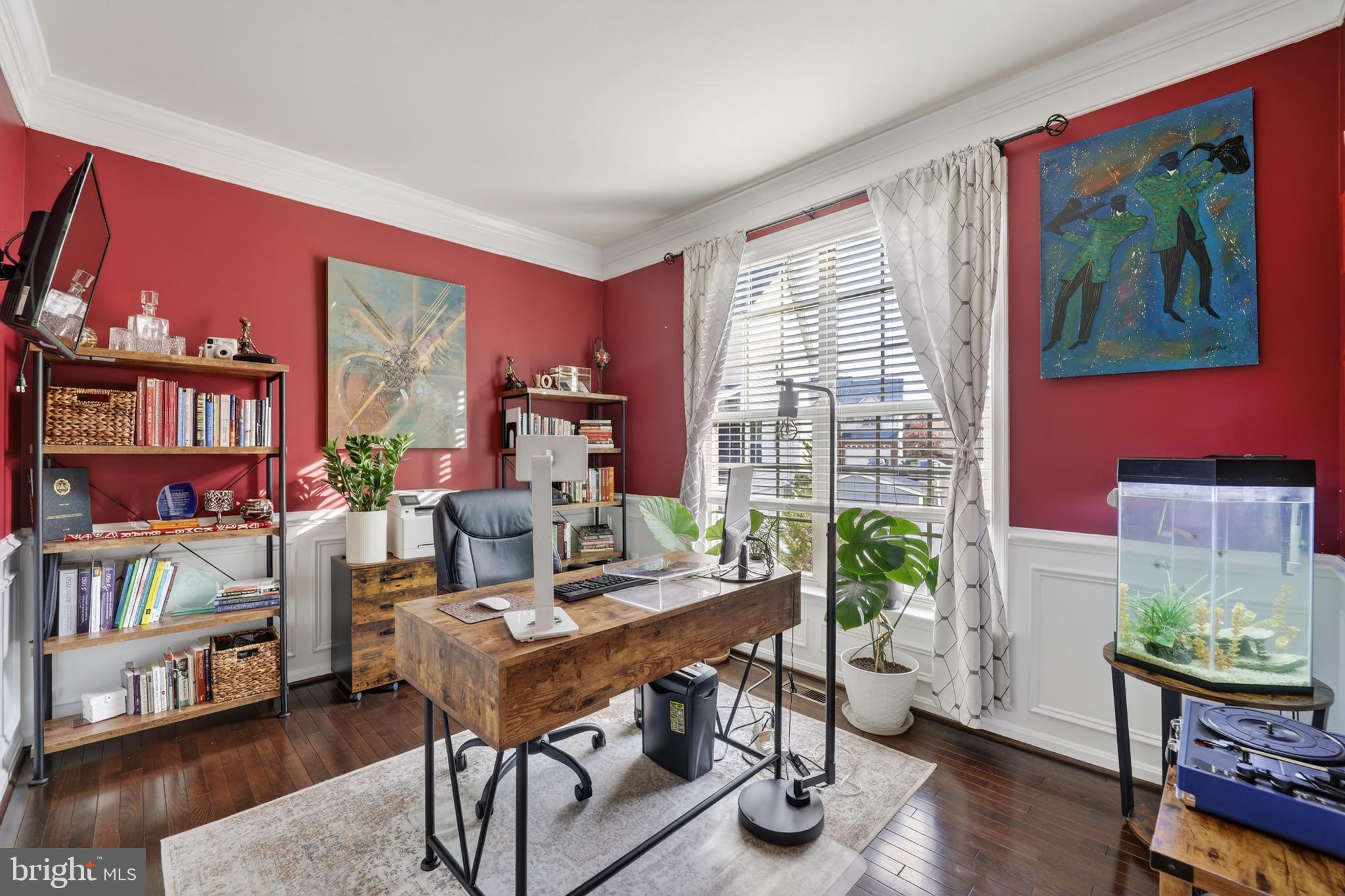9205 Rice Avenue Lanham, MD 20706 - Photo 21 of 68 a view of a workspace with furniture and a potted plant