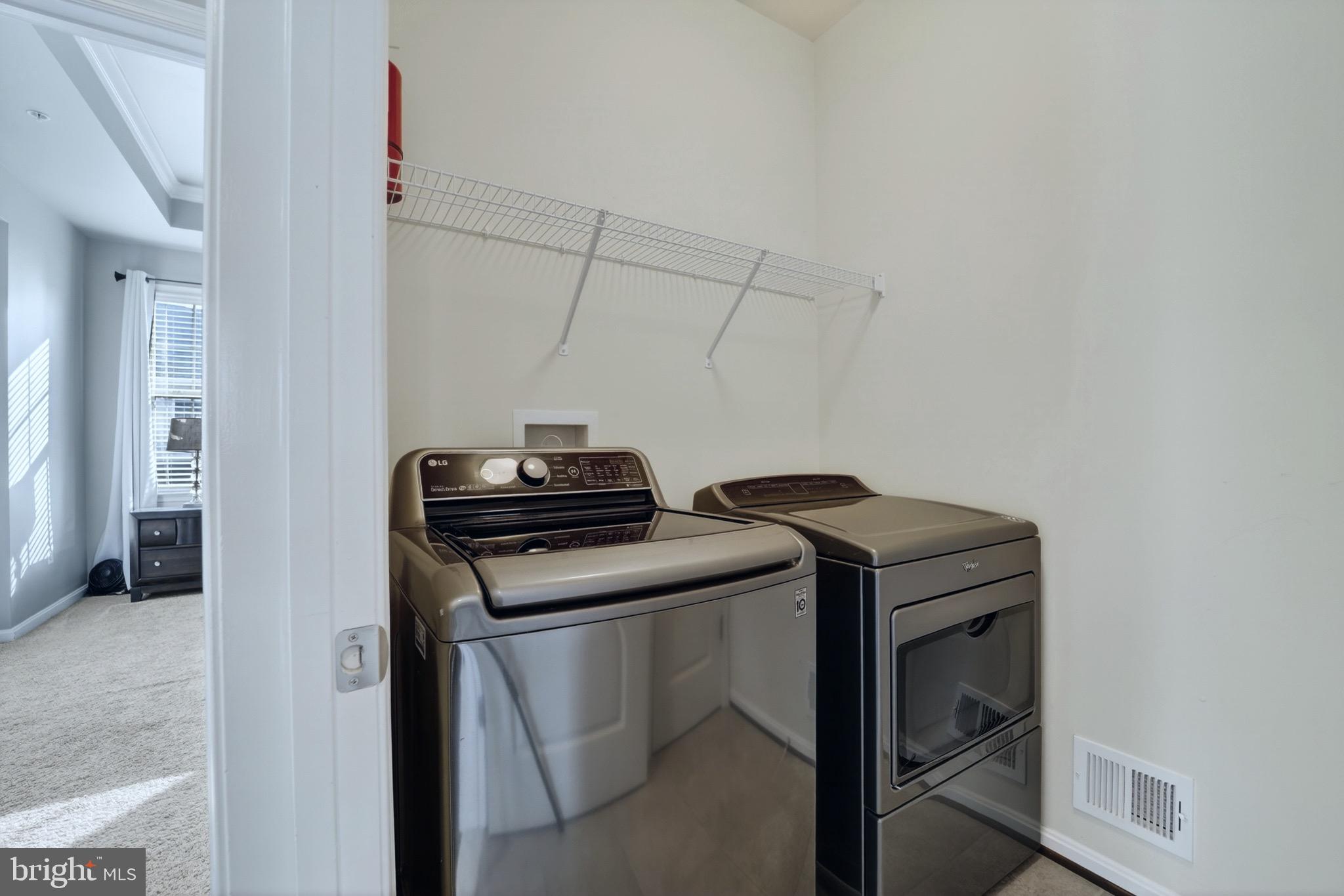 9205 Rice Avenue Lanham, MD 20706 - Photo 26 of 68 a utility room with dryer and washer