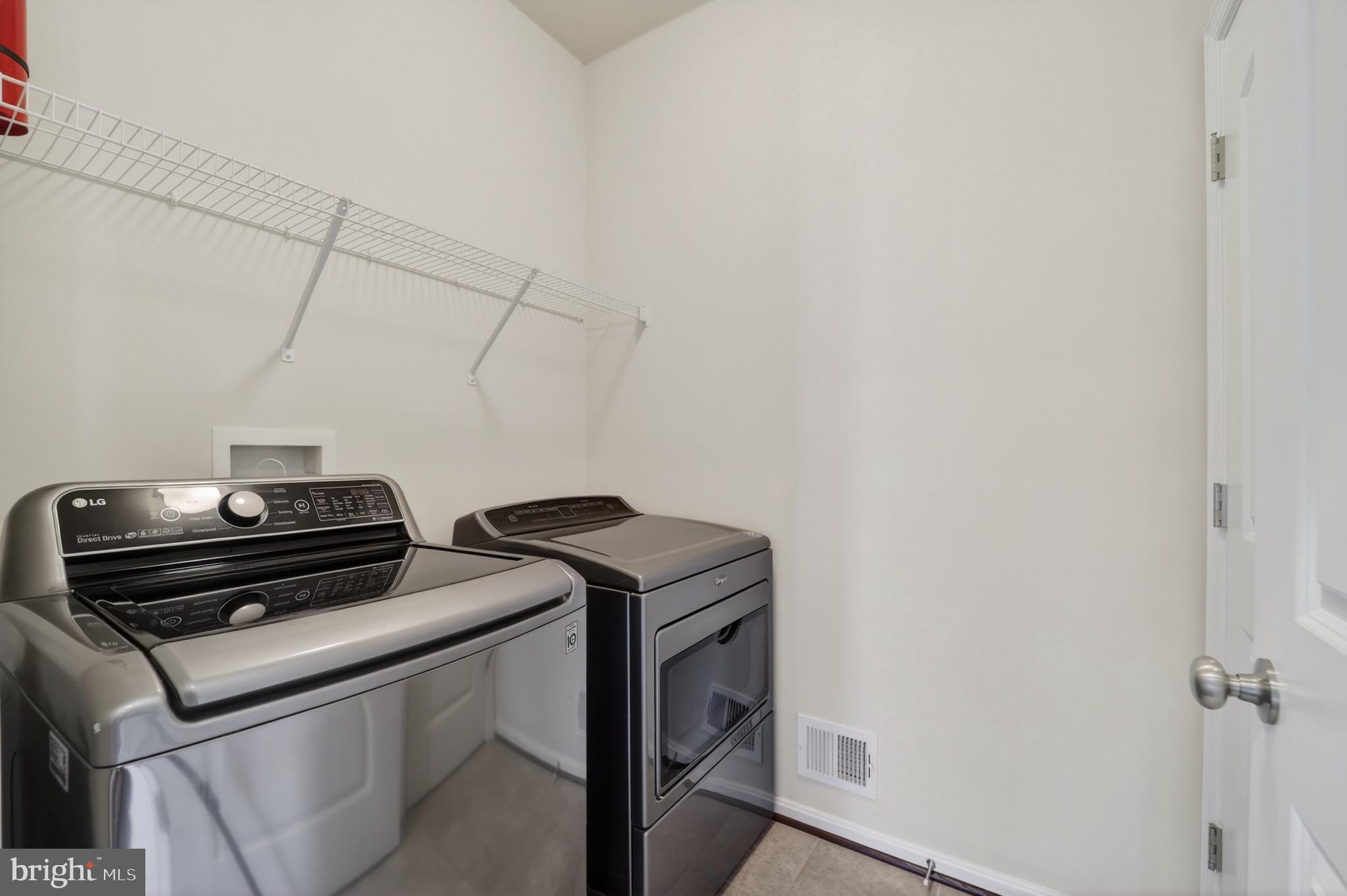9205 Rice Avenue Lanham, MD 20706 - Photo 27 of 68 a utility room with dryer and washer
