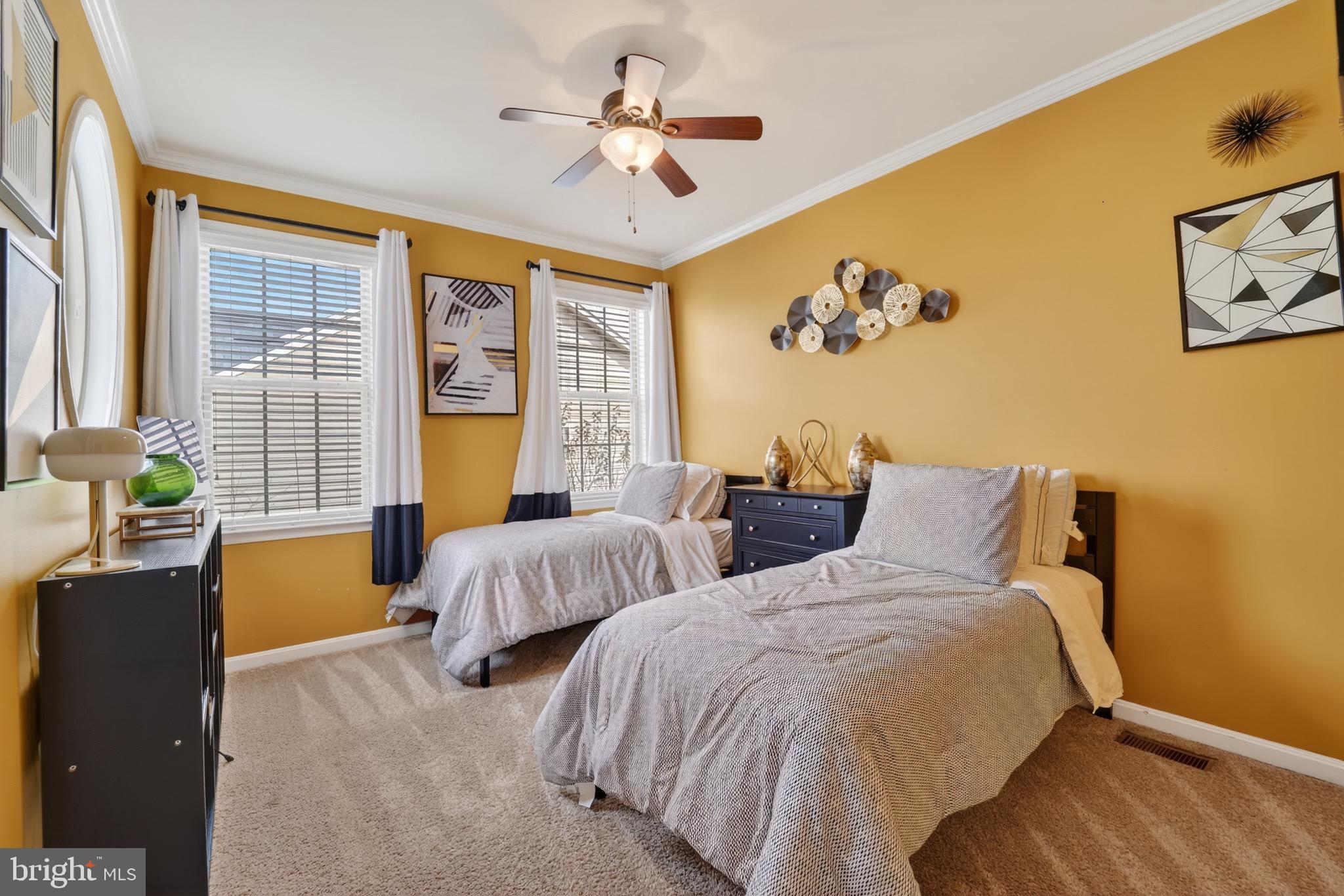 9205 Rice Avenue Lanham, MD 20706 - Photo 33 of 68 a bedroom with two beds and a potted plant