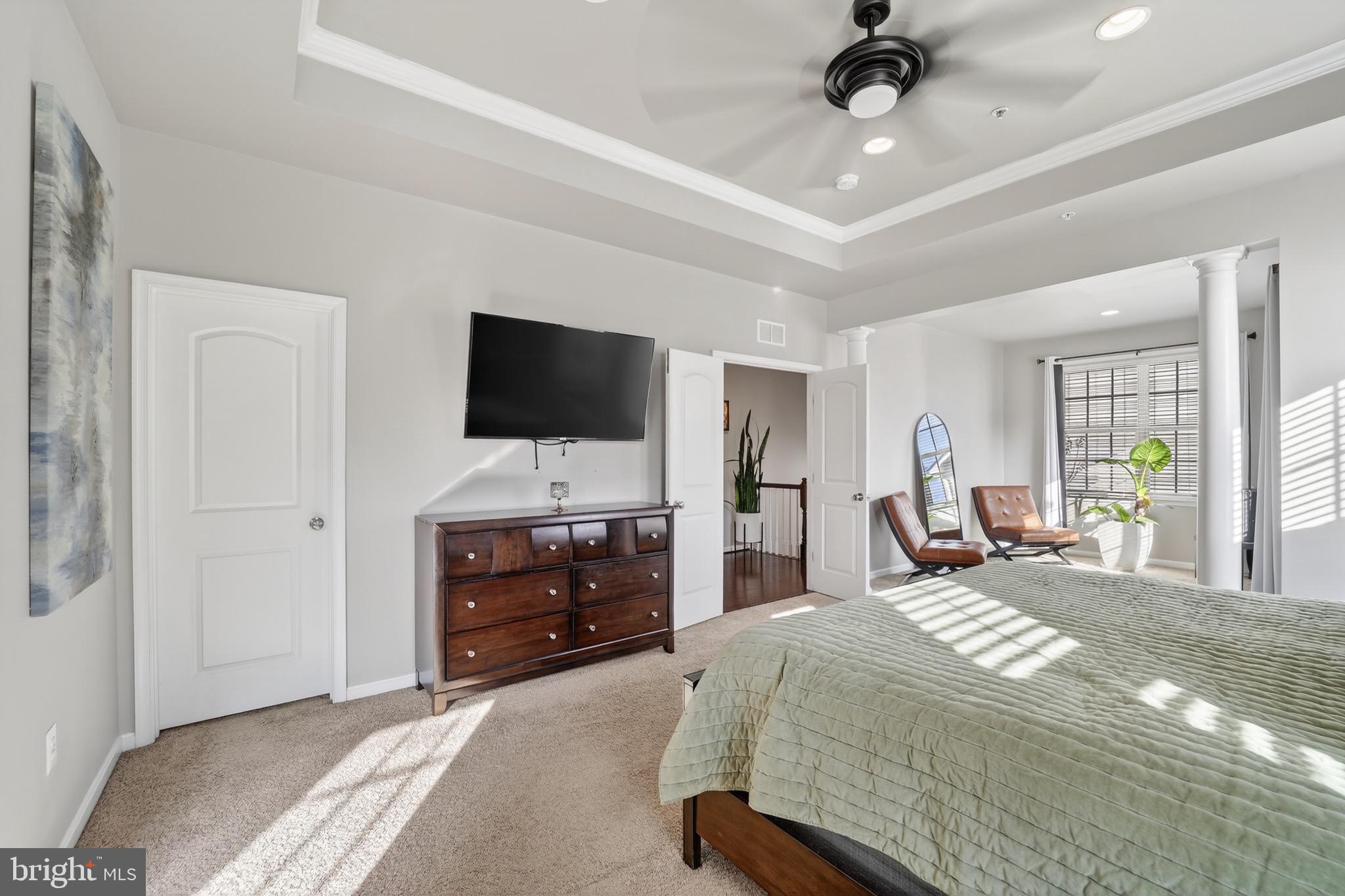 9205 Rice Avenue Lanham, MD 20706 - Photo 35 of 68 a bedroom with a bed and a flat screen tv